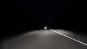 POV timelapse fast car drive old countryroad at night. Flow of oncoming trucks. Drive pov old road timelapse/hyperlapse night. Pov night driving hyperlapse at highway passing a series of tunnels