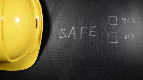 Safety concept written on a board by safety officer