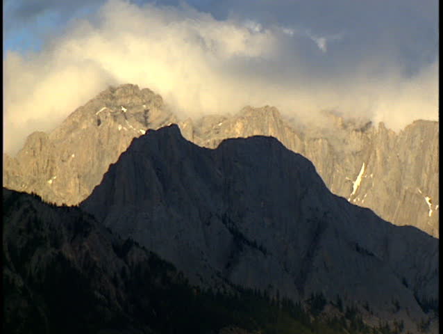 Clouds hanging over mountain ridge