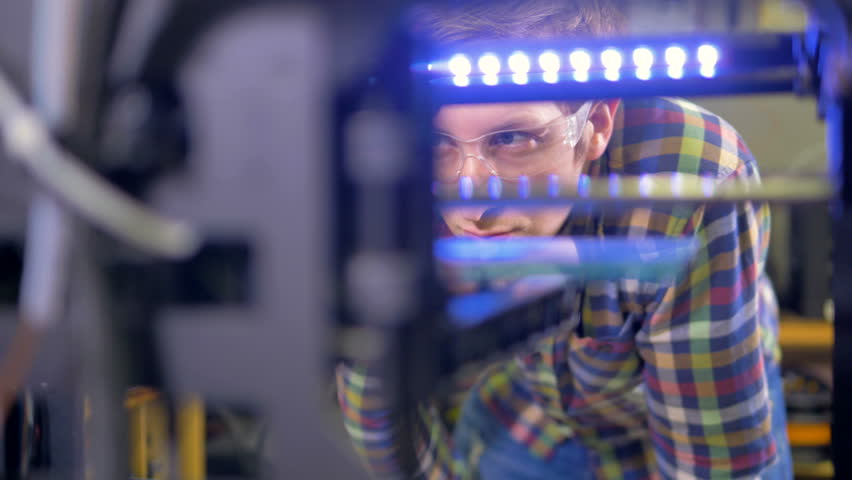 An engineer controls 3d-printer work.  | Shutterstock HD Video #32434861