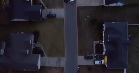 Detective tracking show of a car driving in a neighborhood at night