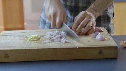 Close up: Preparing onion to cook