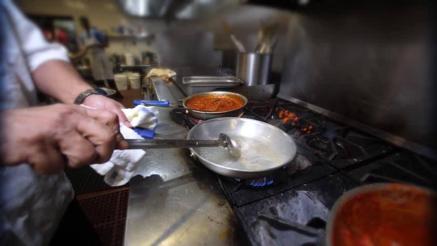 Indian Food Indian Restaurant chef preparing masala food in slow motion. A stir fry meal being prepared in a hotel or restaurant kitchen.  Royalty-Free Stock Footage #32443567