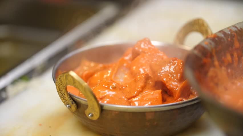 Indian Food Indian Restaurant chef preparing masala food in slow motion. A stir fry meal being prepared in a hotel or restaurant kitchen.  Royalty-Free Stock Footage #32443624