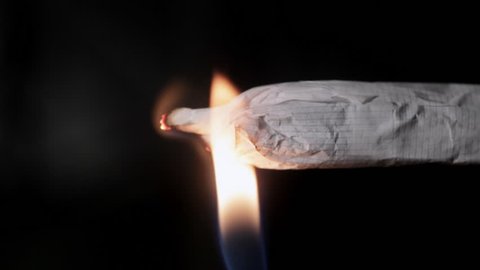 Close up of lighting marijuana joint
