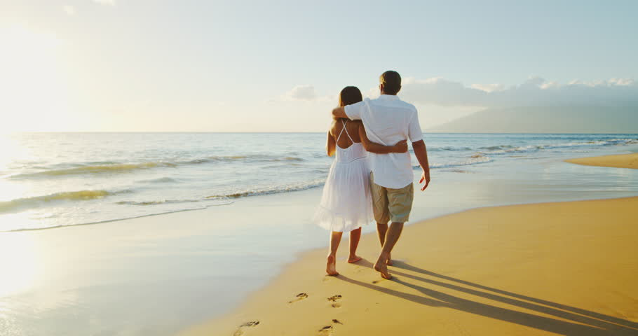 Happy couple walking down the beach at sunset | Shutterstock HD Video #32461678