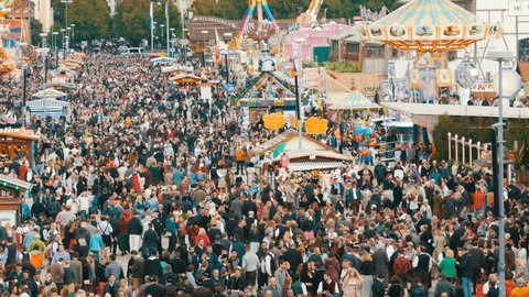 September 17, 2017 - Oktoberfest, Munich, Germany: A view of the huge crowd of people walking around the Oktoberfest in national bavarian suits, on Theresienwiese, top view