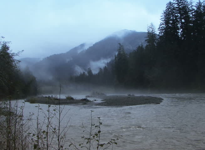 PAL - Time lapse clouds travel over the Hoh river in the Olympic National Park, Washington.