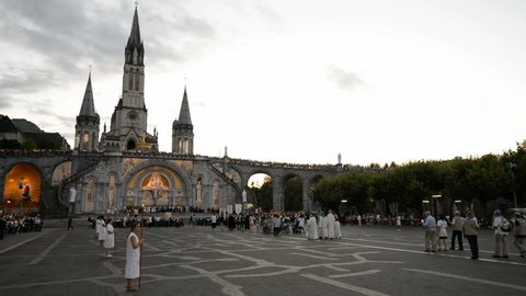 LOURDES, FRANCE  - 4th AUGUST, 2017: Pilgrims procession to Mass, Lourdes, Pyrenees, France, Europe.