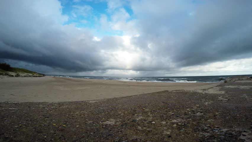 Beach of the Baltic Sea with dramatic sky