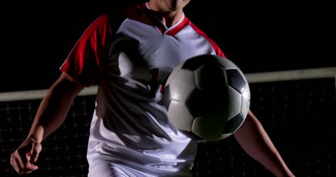 Confident soccer player juggling ball on playing field 4k Video Stok