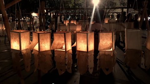 Thailand, Chiang Mai, Three King Monument Square, November, 2018. Hanging Lanterns with Candles Inside. Suitable for titles and romantic atmosphere 4k video. Rectangular Lanterns. Yee Peng Festival. – Video có sẵn