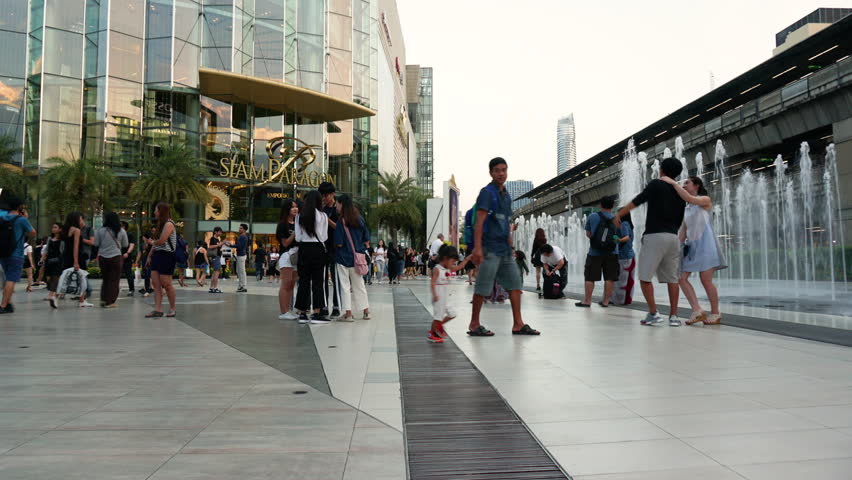 BANGKOK, THAILAND - OCTOBER 28, 2017: Thai and Oversea Tourists walking and photography in front of Siam Paragon Shopping Mall. Siam Paragon is the most popular and luxurious shopping center in Bangkok