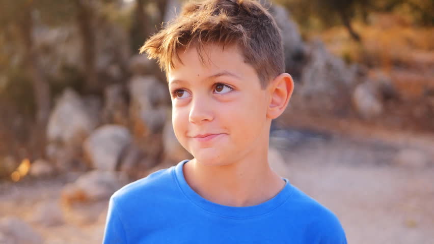 Cheerful little boy play the ape