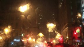 Rain at night in Chicago traffic, video
