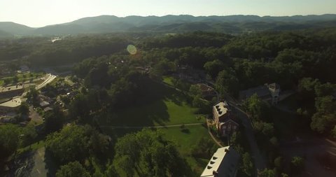 Aerial views of the Davis & Elkins College campus just before sunset on a beautiful summer evening with the mountains all around.