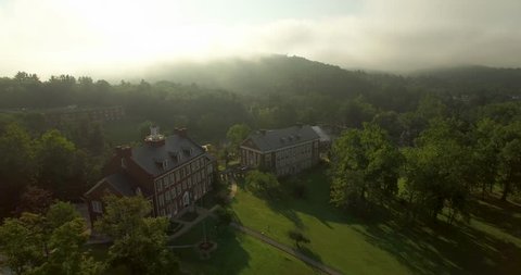 Gorgeous panoramic views of the Davis & Elkins College campus on a warm morning with fog. Liberal Arts Hall is the centerpiece for this aerial.