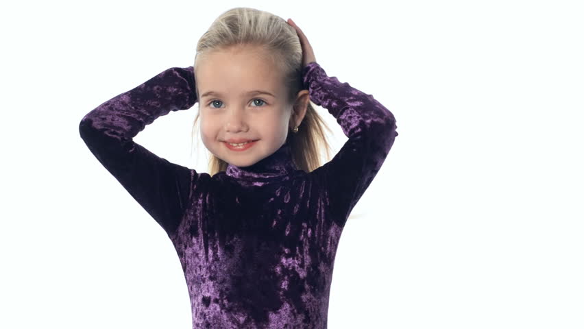 A gorgeous little girl smiling  with the wind in her hair