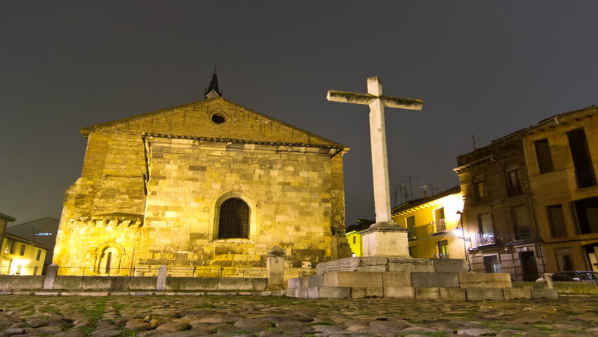 LEON, SPAIN - CIRCA 2012: Christian church and cross at night. Timelapse with