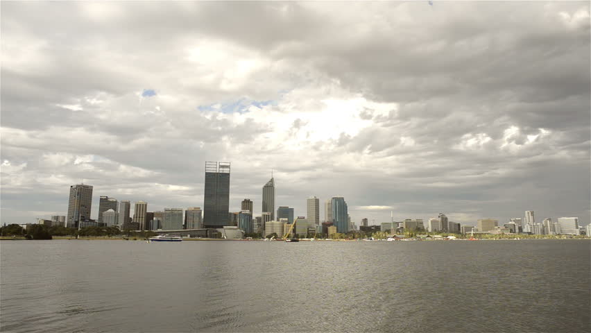 View of Perth City from across the Swan River on a cloudy summer day.