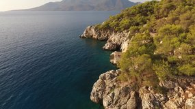 Aerial drone bird's eye view video of famous island of Agistri with turquoise clear water seascape, Saronic gulf, Greece