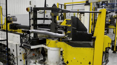 Robot bending pipe in factory