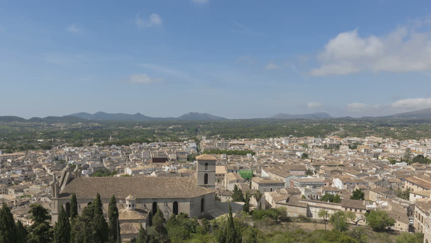 Time lapse view over the city of Arta with clouds passing by