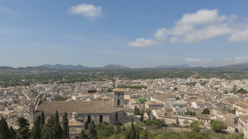 Time lapse view over the city of Arta with clouds passing by