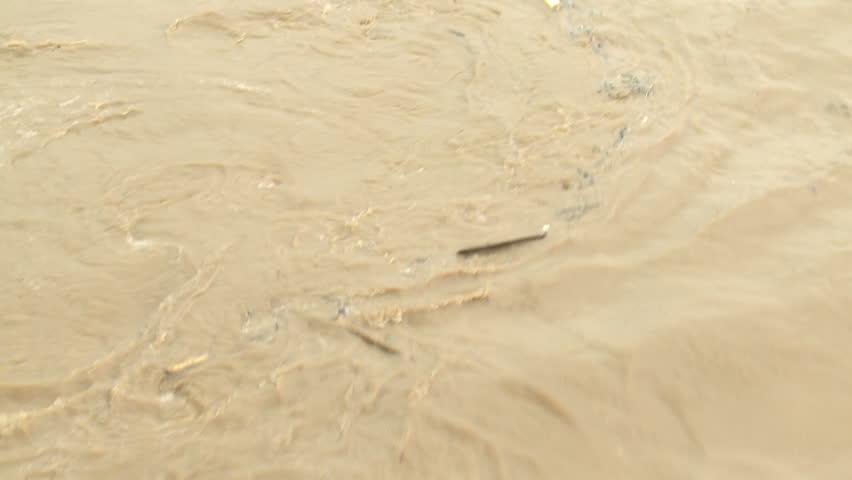 Swirling Polluted Muddy Flood Waters. Shot on Sony EX1 XDCAM in full HD