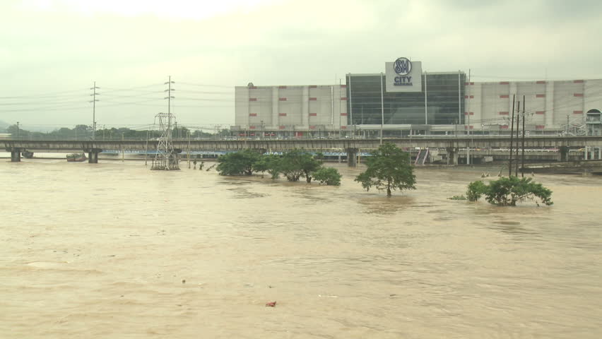 MANILA, PHILIPPINES - AUGUST 2012: River In Full Flood After Monsoon Rains