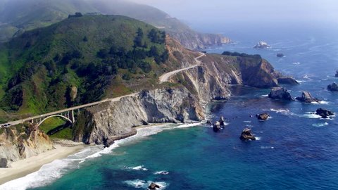 Aerial Drone Stock Video of Big Sur rocky Coastline with Bridge