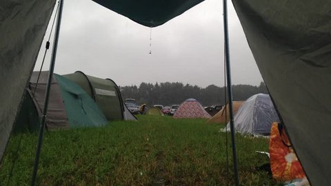 Tent lookout during rain on a camp.