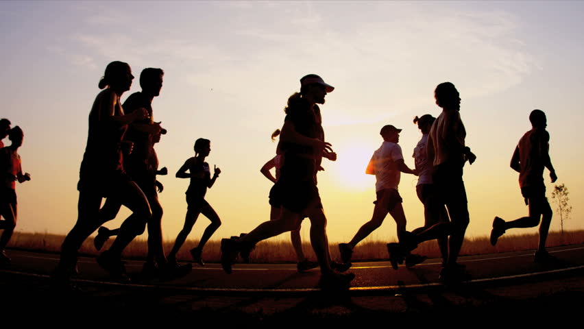 Silhouette runners on racing track shot on RED EPIC | Shutterstock HD Video #3256249