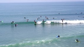 Aerial Drone Stock Video longboard Surfers in Malibu on sunny day
