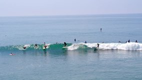 Aerial Drone Stock Video longboard Surfers in Malibu on sunny day