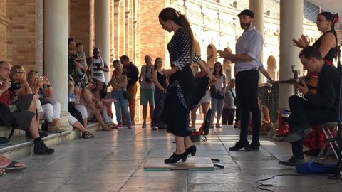 SEVILLE, SPAIN - CIRCA OCTOBER 2017: Group of flamenco dancers in Plaza de Espana in Seville, Spain
