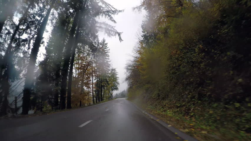 Driving car on foggy wet weather day Royalty-Free Stock Footage #32586559