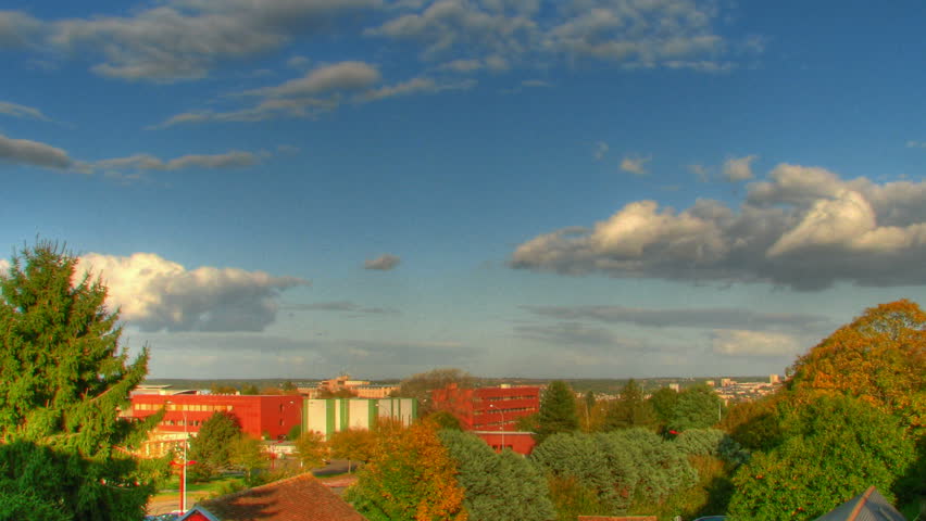 Clouds over streets, HD time lapse clip, high dynamic range imaging