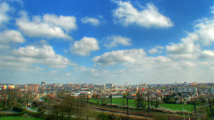 Clouds over city, HD time lapse clip, high dynamic range imaging