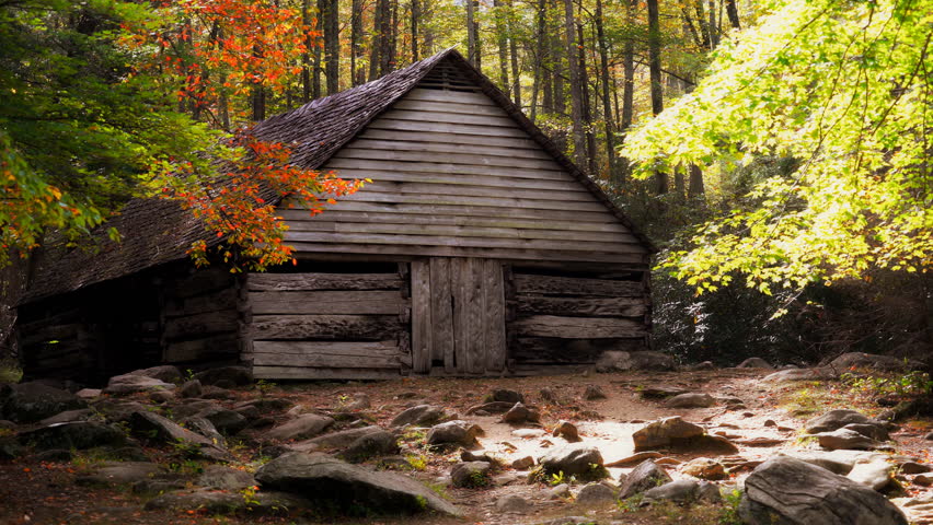A historic barn in the Tennessee mountains during autumn