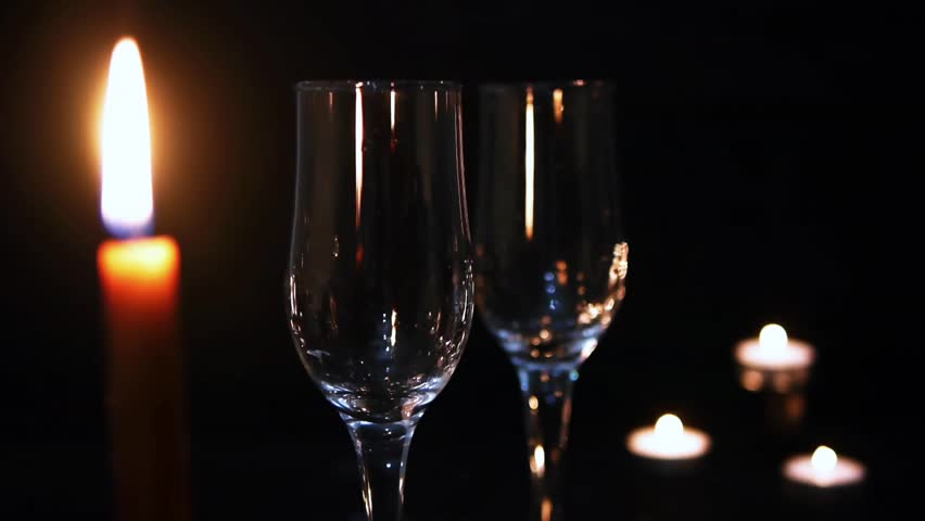 two glasses of champagne in the candlelight
