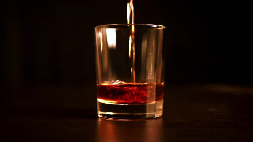 shot of whiskey on the wooden table