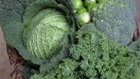 various green cabbages in basked rotating on daylight Seasonal Vegetables 