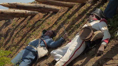 VIRGINIA - AUGUST 2017 - Mexican War Soldiers - Re-enactors, reenactment.  American and Mexican Army Soldiers with musket rifles - battle combat casualties, dead in trenches after battle. 