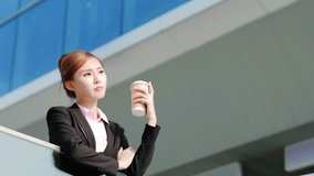 unhappy business woman drink coffee with office background