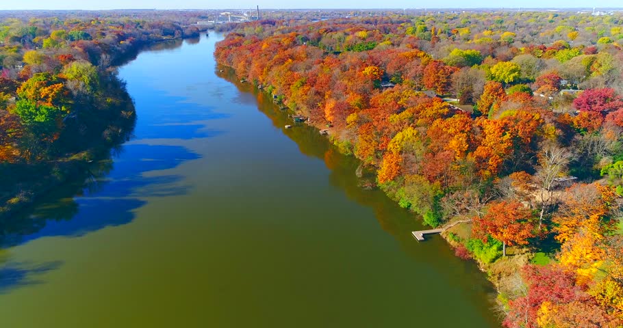 Amazing colorful Autumn trees along riverside, small town, Wisconsin.
