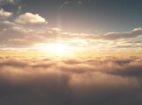 Aerial Sunrise.  Sunrise as seen from the air between two different cloud layers.  Sun in front of camera.