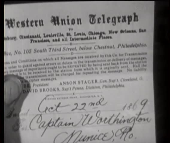 Close-up of a person holding a Western Union telegraph