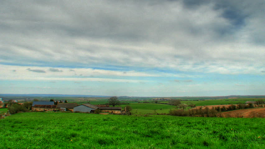 Clouds over farm fields, HD time lapse, high dynamic range imaging 