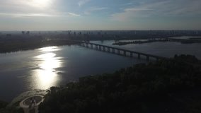 Aerial Drone Flight Footage: Kiev, Ukraine. Aerial view of bridge. Bridge over Dnieper river. Sunrise on the Dnieper river.